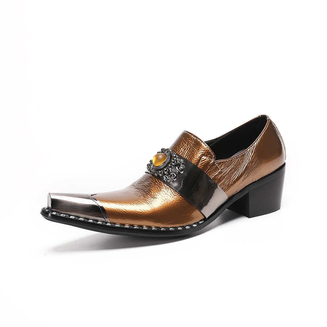 Pair of men's bronze patent leather high heel slip-on shoes with pointed metal toe caps and ornate vamp embellishments on a