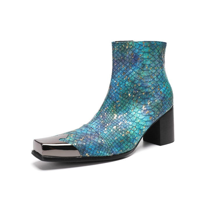 A pair of men's teal snake print ankle boots with a square metal tip and black block heel, shown on a white background.