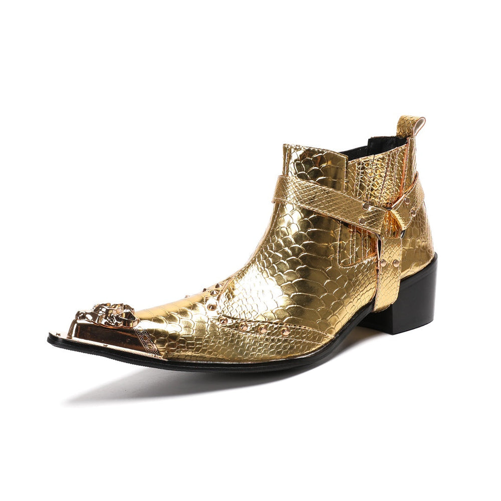A pair of shiny gold snake skin textured ankle boots with a pointed metal toe cap, studded details, and an ankle strap.
