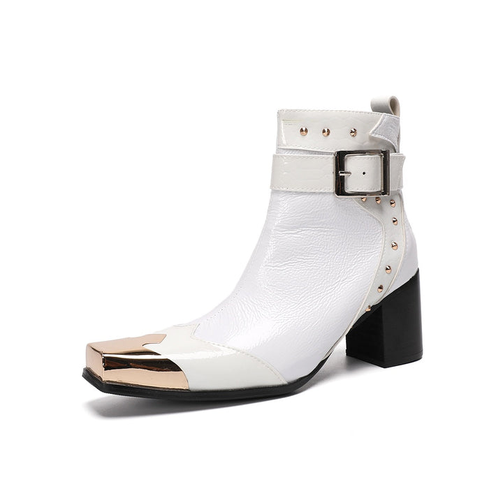 Pair of Dolashoes white patent leather ankle boots with gold metal square toe, studded buckle strap, and black block heel.