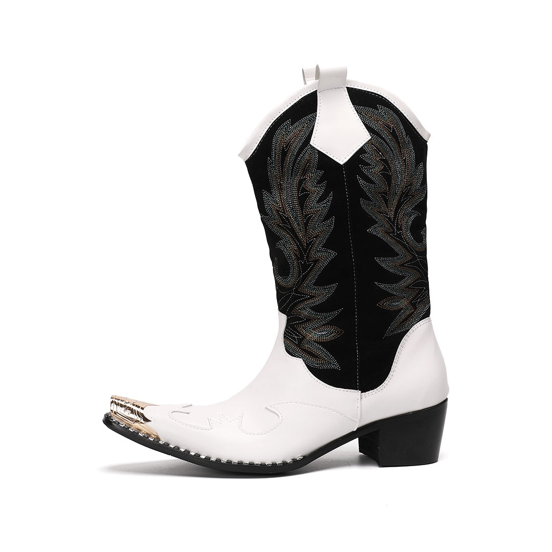 Pair of white and black embroidered cowboy boots with a gold metal tip on a white background.