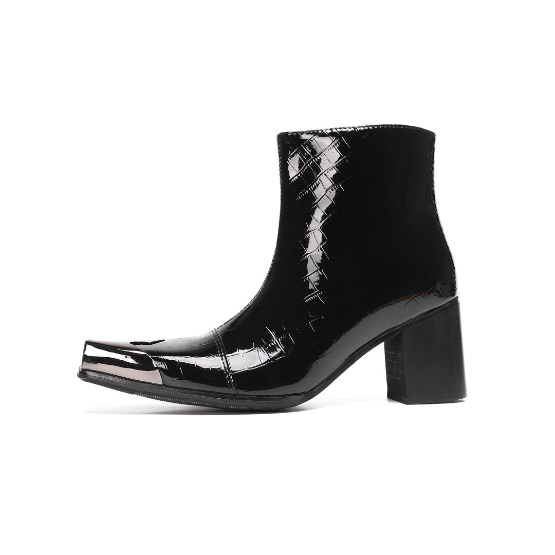 Pair of black patent crocodile embossed ankle boots with square metal toe caps and block heels, side view.