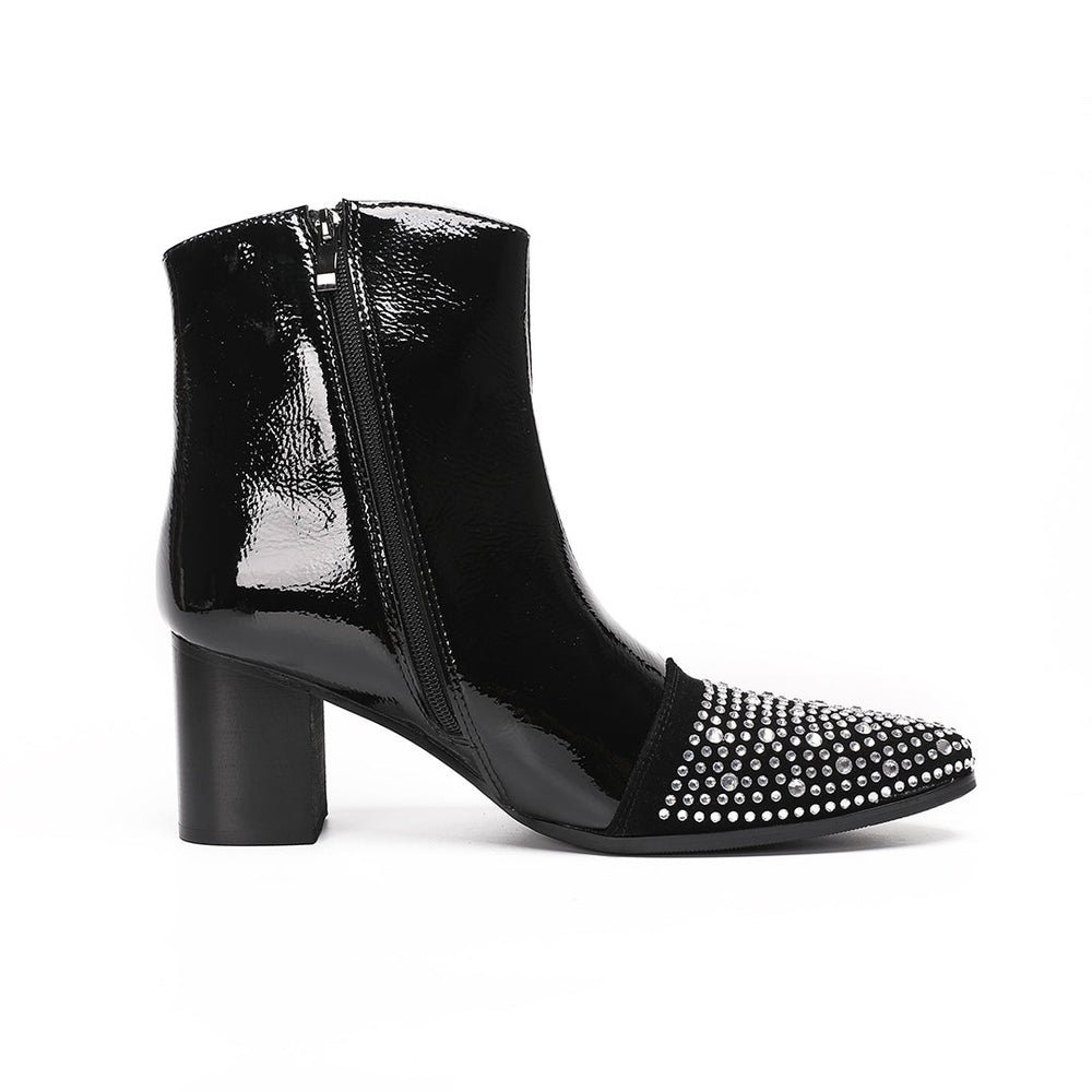 A pair of black patent leather ankle boots with rhinestone-embellished pointed toes and block heels.