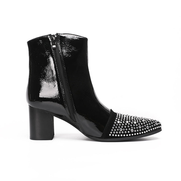 A pair of black patent leather ankle boots with rhinestone-embellished pointed toes and block heels.