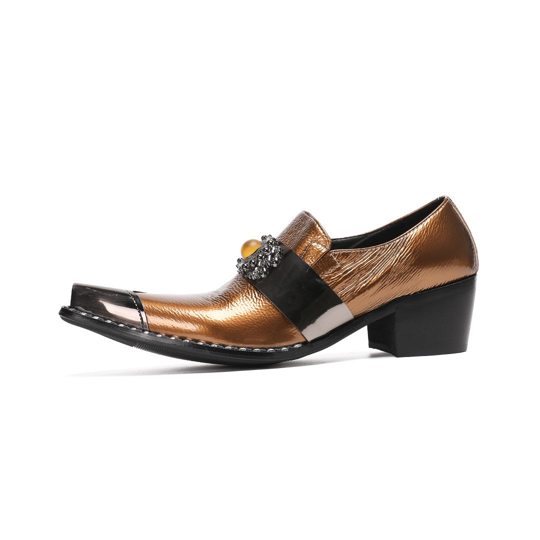 Pair of men's bronze patent leather high heel slip-on shoes with pointed metal toe caps and ornate vamp embellishments on a