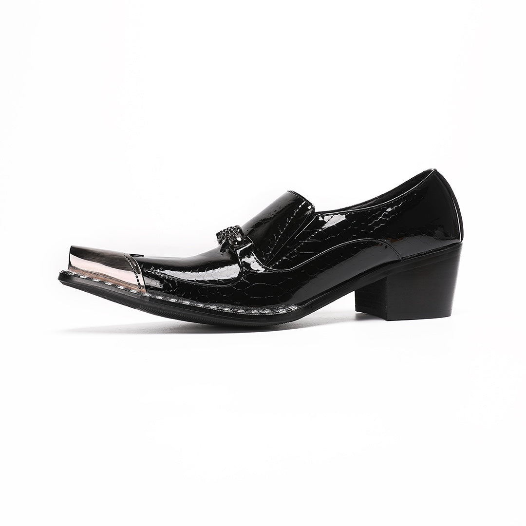 Pair of black patent leather men's loafers with silver metal cap toes and decorative buckles.