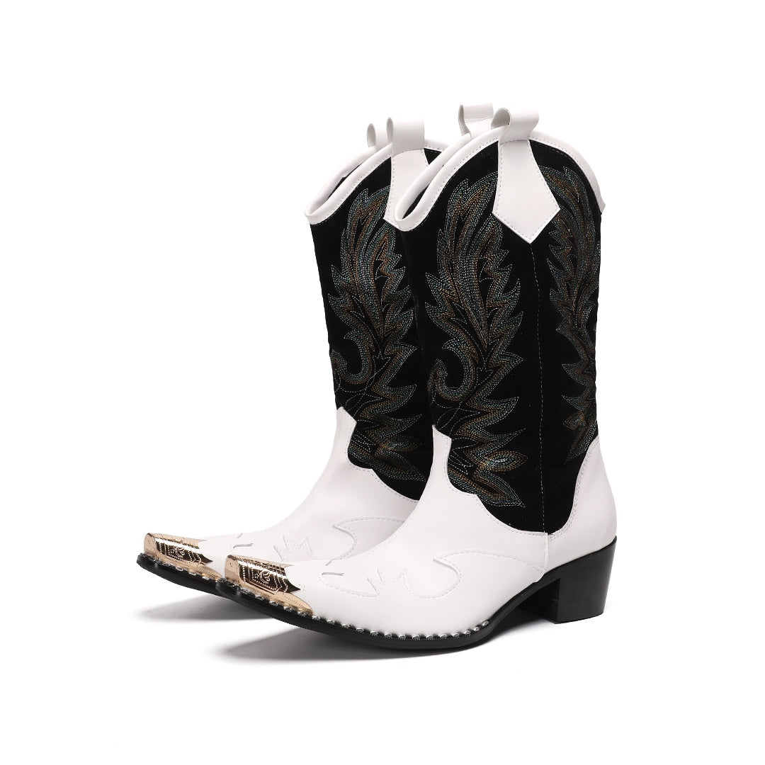 Pair of white and black embroidered cowboy boots with a gold metal tip on a white background.