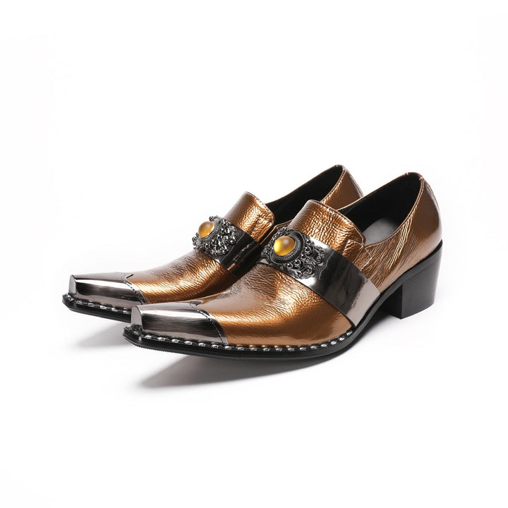 Pair of men's bronze patent leather high heel slip-on shoes with pointed metal toe caps and ornate vamp embellishments on a
