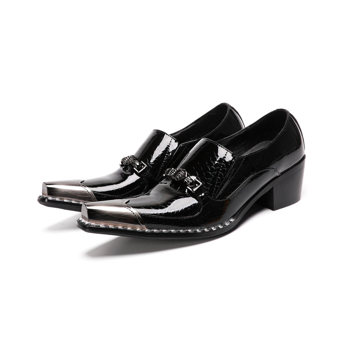 Pair of black patent leather men's loafers with silver metal cap toes and decorative buckles.