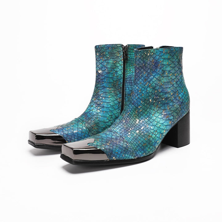 A pair of men's teal snake print ankle boots with a square metal tip and black block heel, shown on a white background.