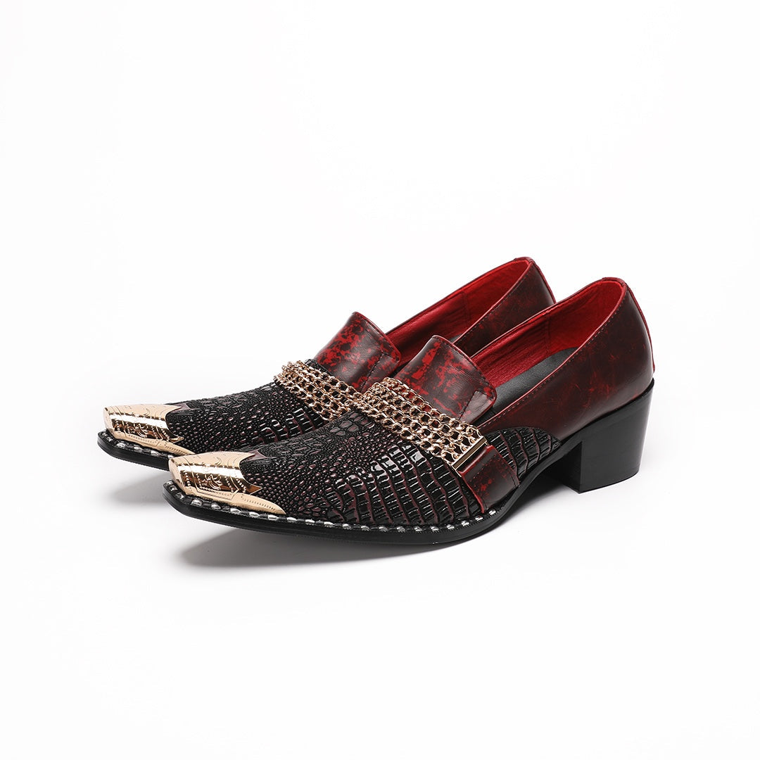 A pair of Dolashoes men's red and black textured leather loafers with gold metal toe caps and chain embellishments on a white