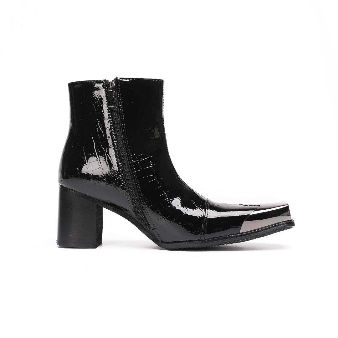 Pair of black patent crocodile embossed ankle boots with square metal toe caps and block heels, side view.