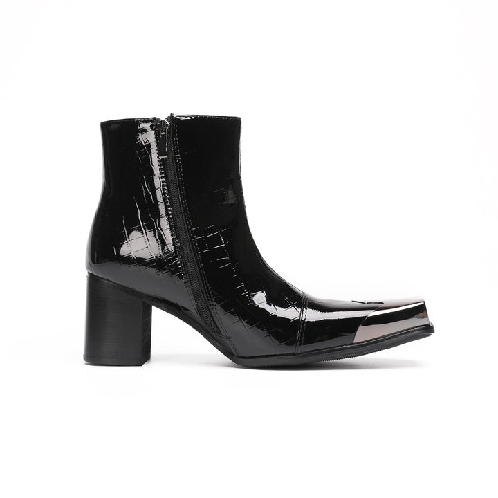 Pair of black patent crocodile embossed ankle boots with square metal toe caps and block heels, side view.