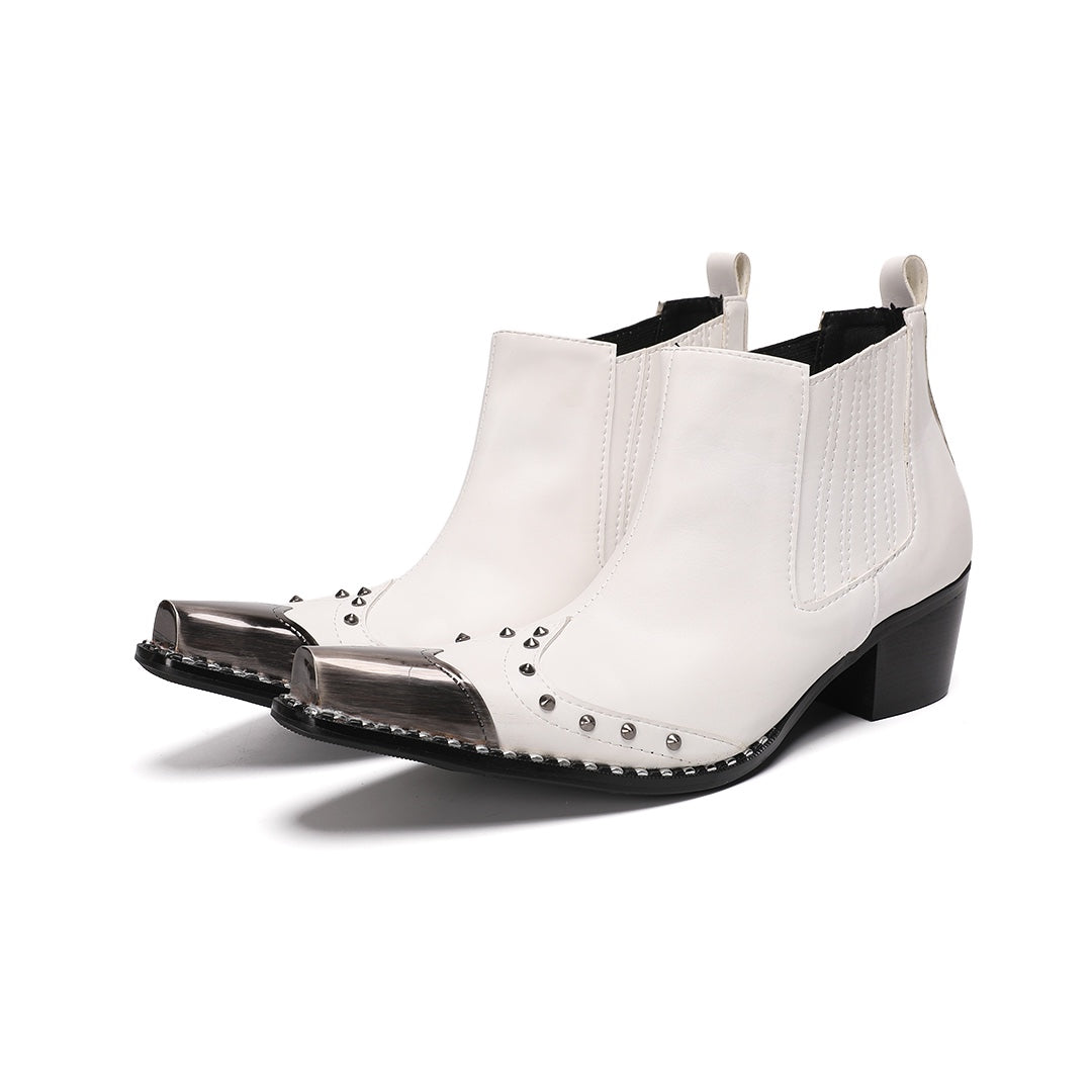 Pair of white studded Chelsea boots with silver metal toe caps and black heels on a white background.