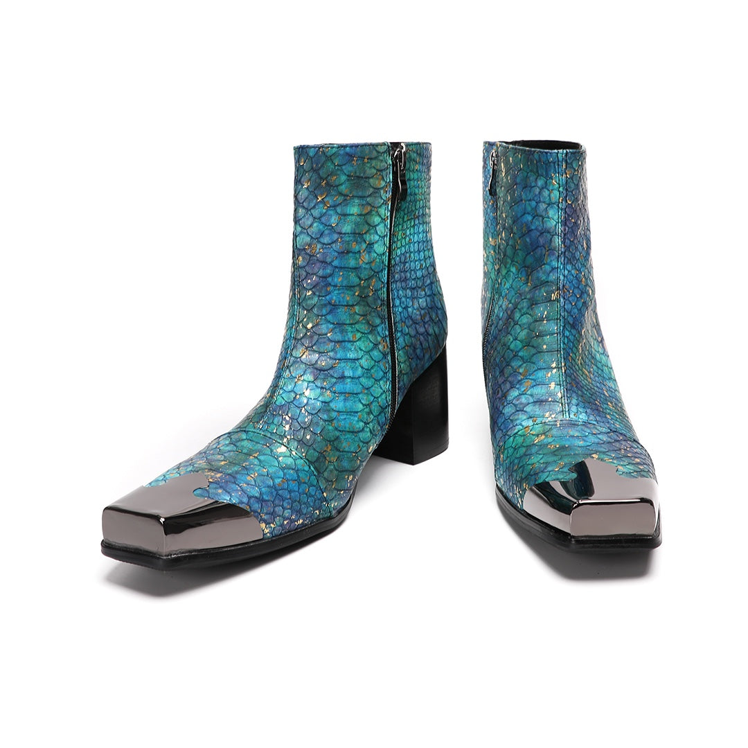A pair of men's teal snake print ankle boots with a square metal tip and black block heel, shown on a white background.