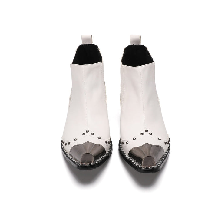 Pair of white studded Chelsea boots with silver metal toe caps and black heels on a white background.