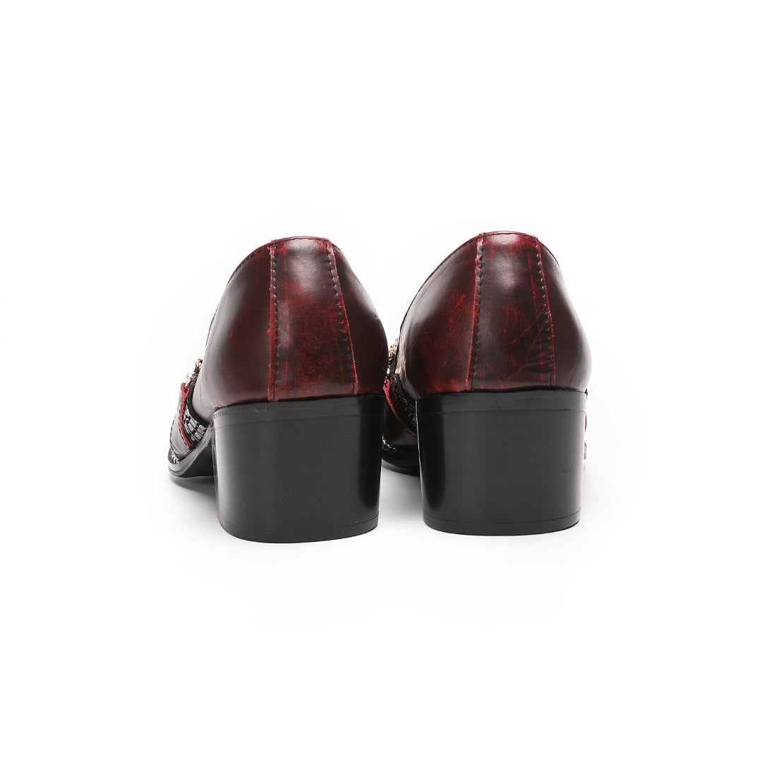 A pair of Dolashoes men's red and black textured leather loafers with gold metal toe caps and chain embellishments on a white