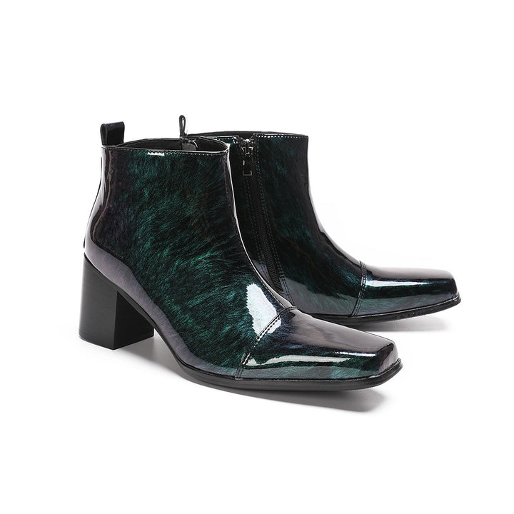 Pair of Dolashoes iridescent green-purple patent leather square toe ankle boots with block heels and side zippers, displayed