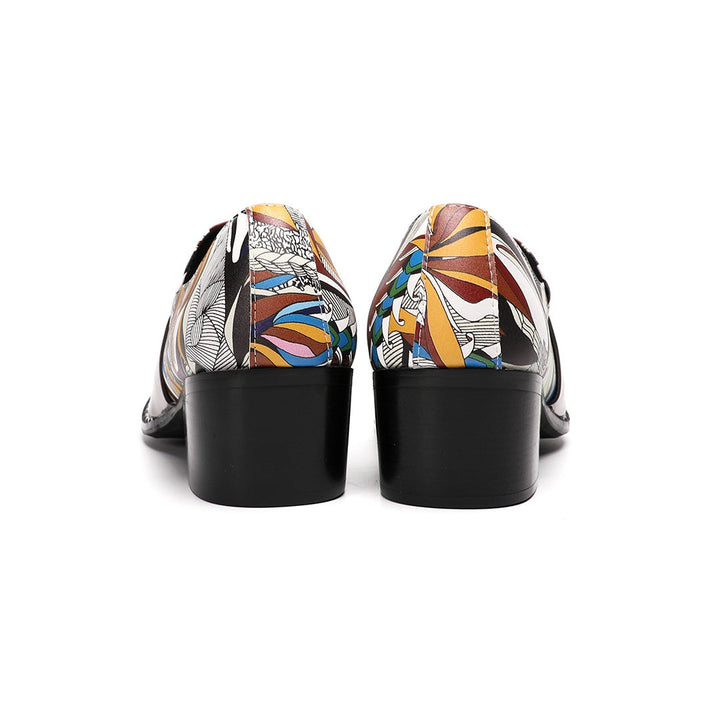 A single men's artistic patterned pointed toe shoe with a metal tip and an ornate buckle, displayed on a white background.