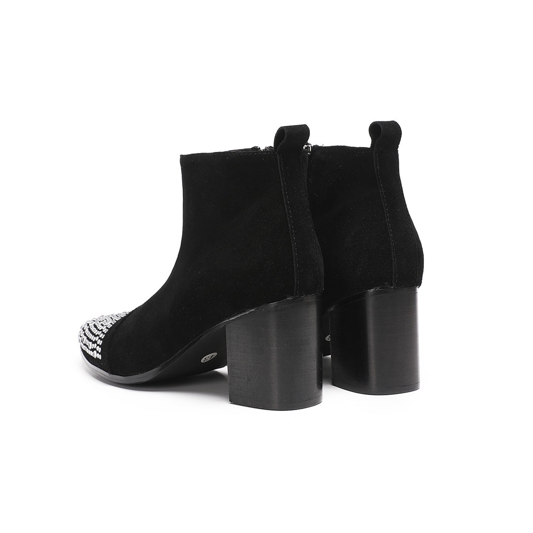 Pair of black suede ankle boots with a studded pointed toe and block heels, shown from various angles.