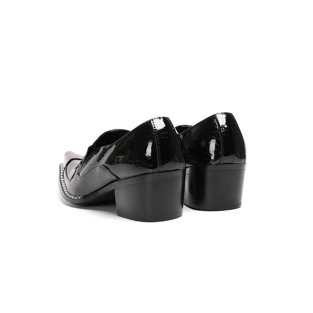 Pair of black patent leather men's loafers with silver metal cap toes and decorative buckles.