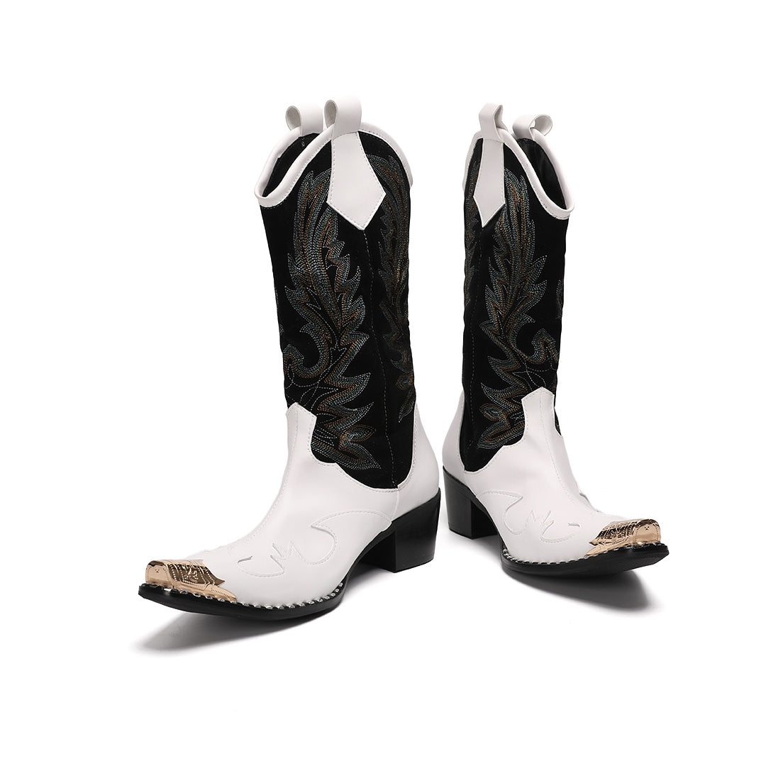 Pair of white and black embroidered cowboy boots with a gold metal tip on a white background.