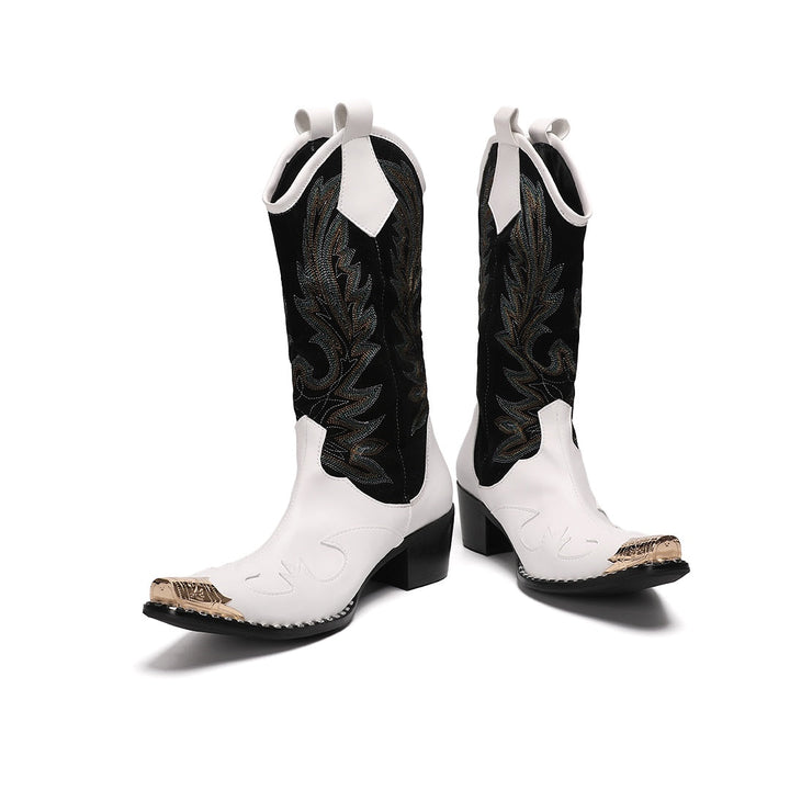 Pair of white and black embroidered cowboy boots with a gold metal tip on a white background.