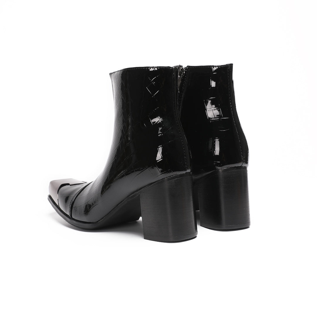Pair of black patent crocodile embossed ankle boots with square metal toe caps and block heels, side view.