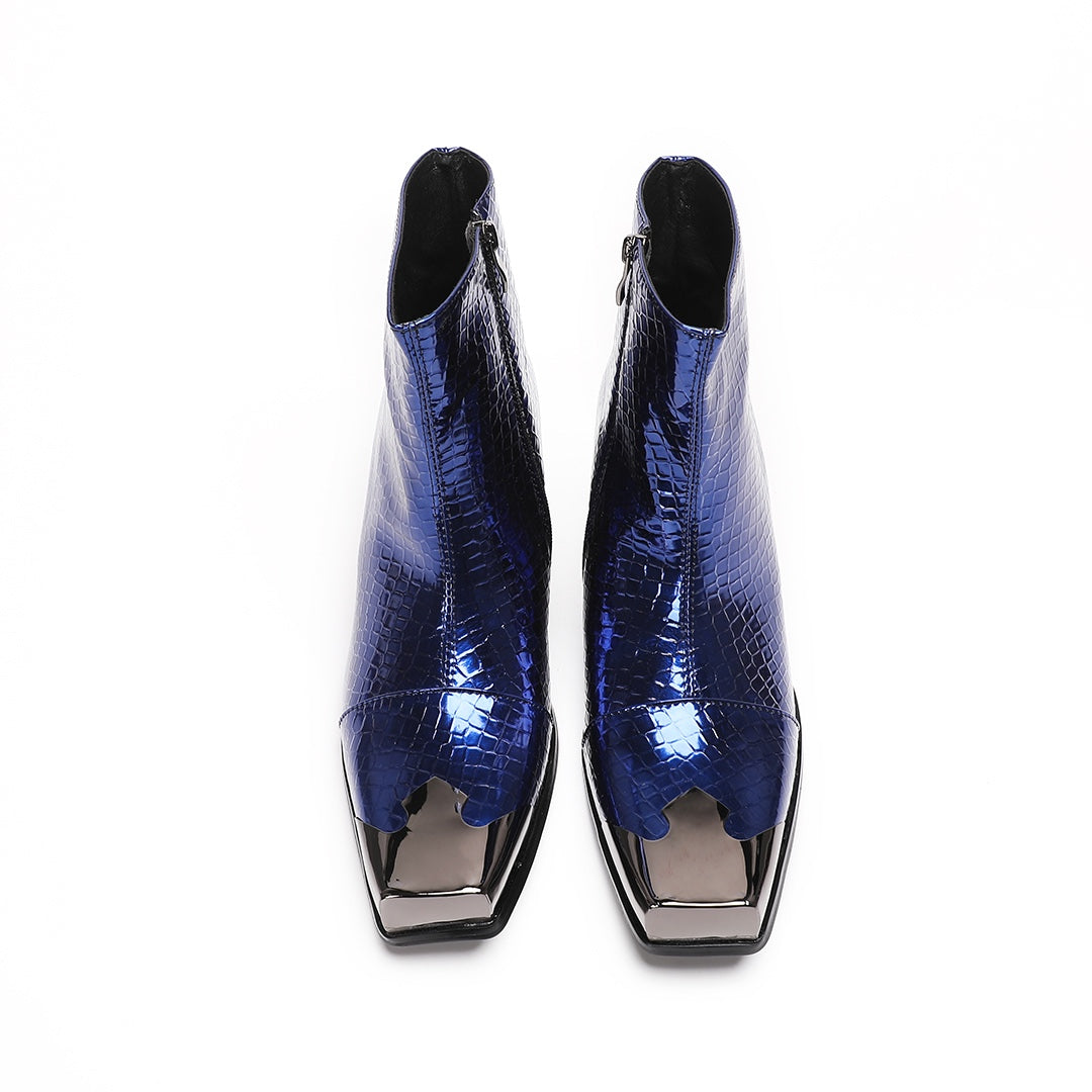 Pair of men's blue patent croc-embossed ankle boots with a square metal toe cap and block heel.