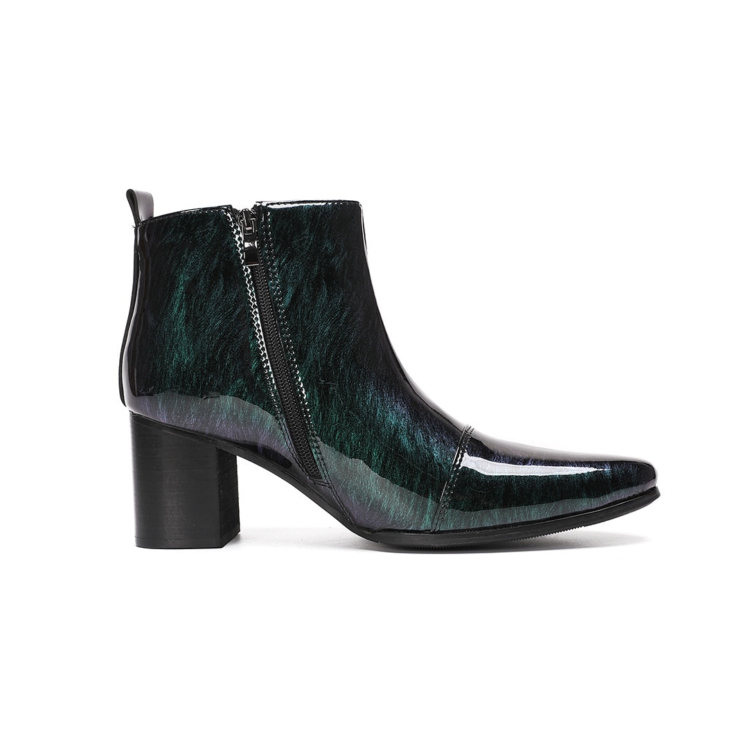 Pair of iridescent dark green patent leather pointed toe ankle boots with block heels and side zippers.