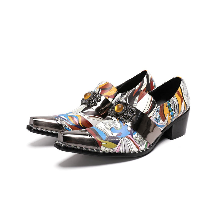 A single men's artistic patterned pointed toe shoe with a metal tip and an ornate buckle, displayed on a white background.