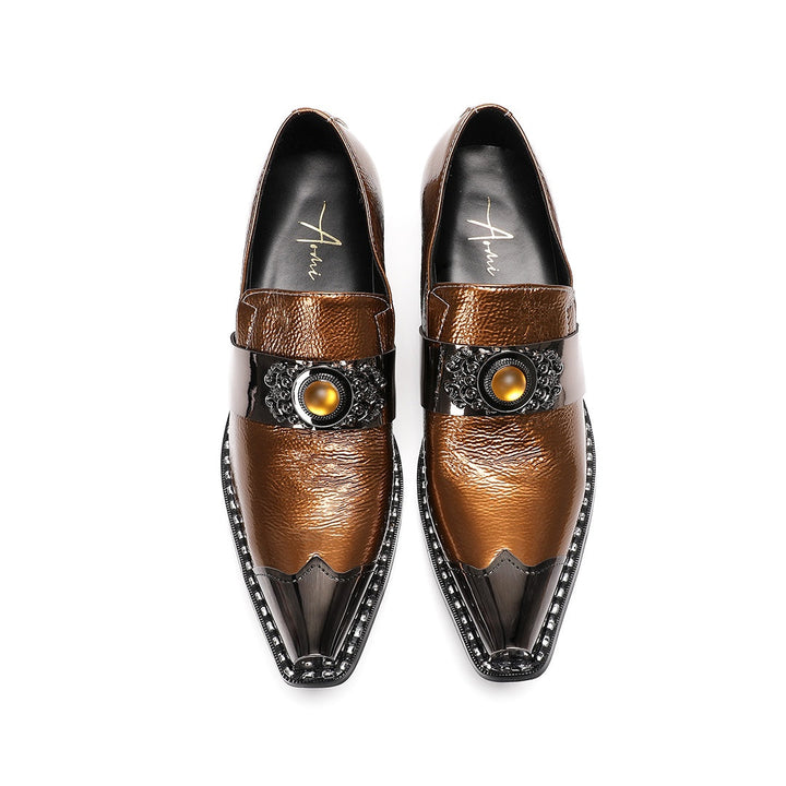 Pair of men's bronze patent leather high heel slip-on shoes with pointed metal toe caps and ornate vamp embellishments on a