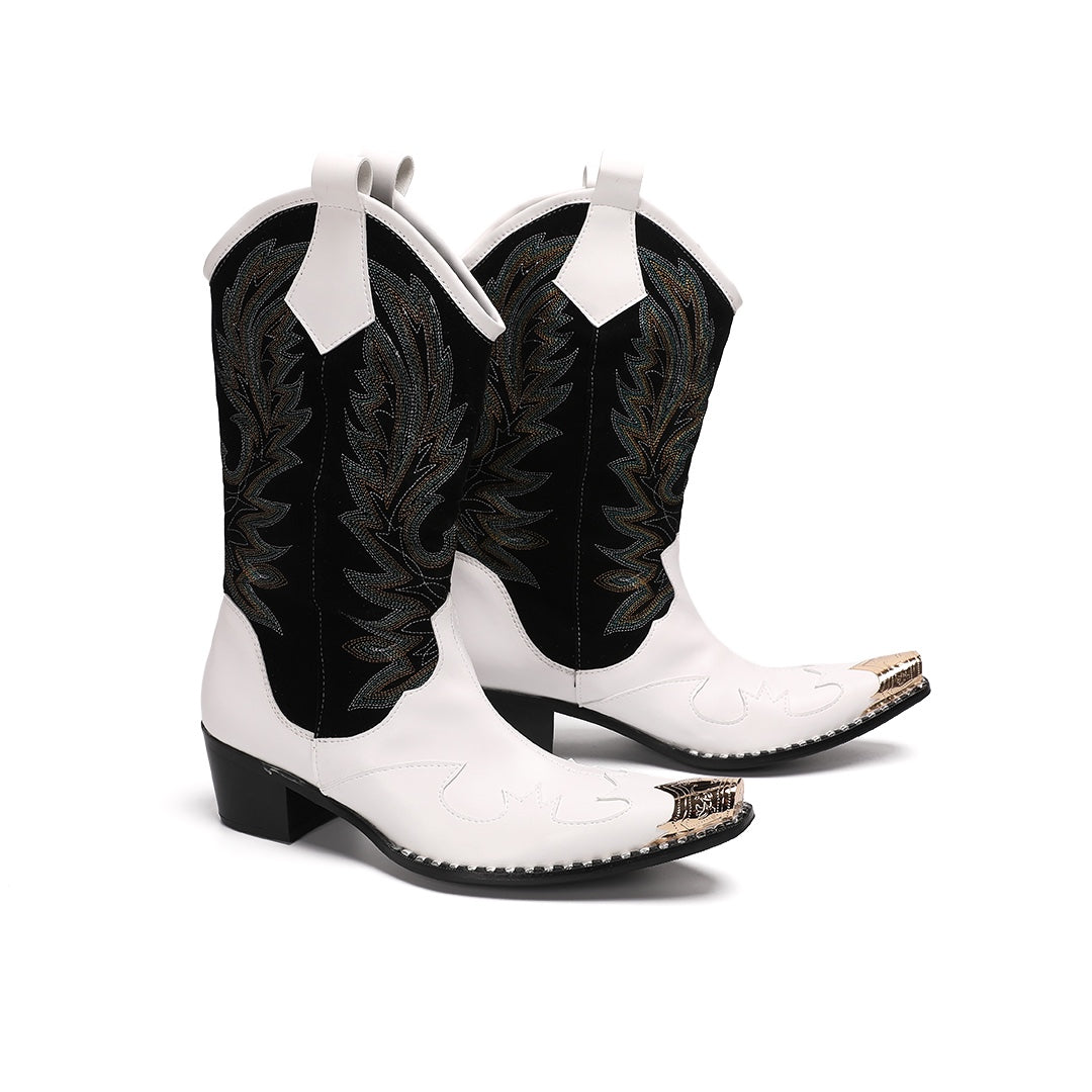 Pair of white and black embroidered cowboy boots with a gold metal tip on a white background.