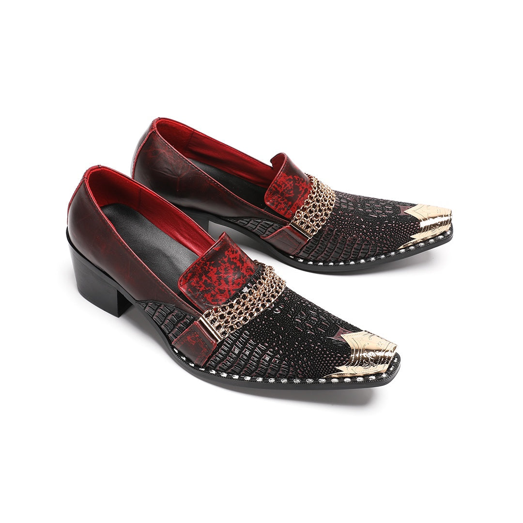 A pair of Dolashoes men's red and black textured leather loafers with gold metal toe caps and chain embellishments on a white