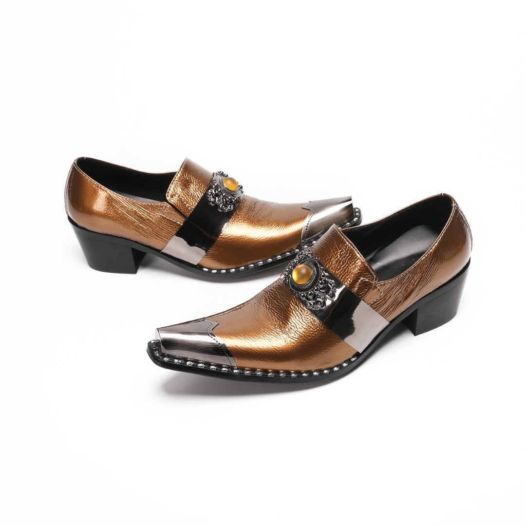 Pair of men's bronze patent leather high heel slip-on shoes with pointed metal toe caps and ornate vamp embellishments on a