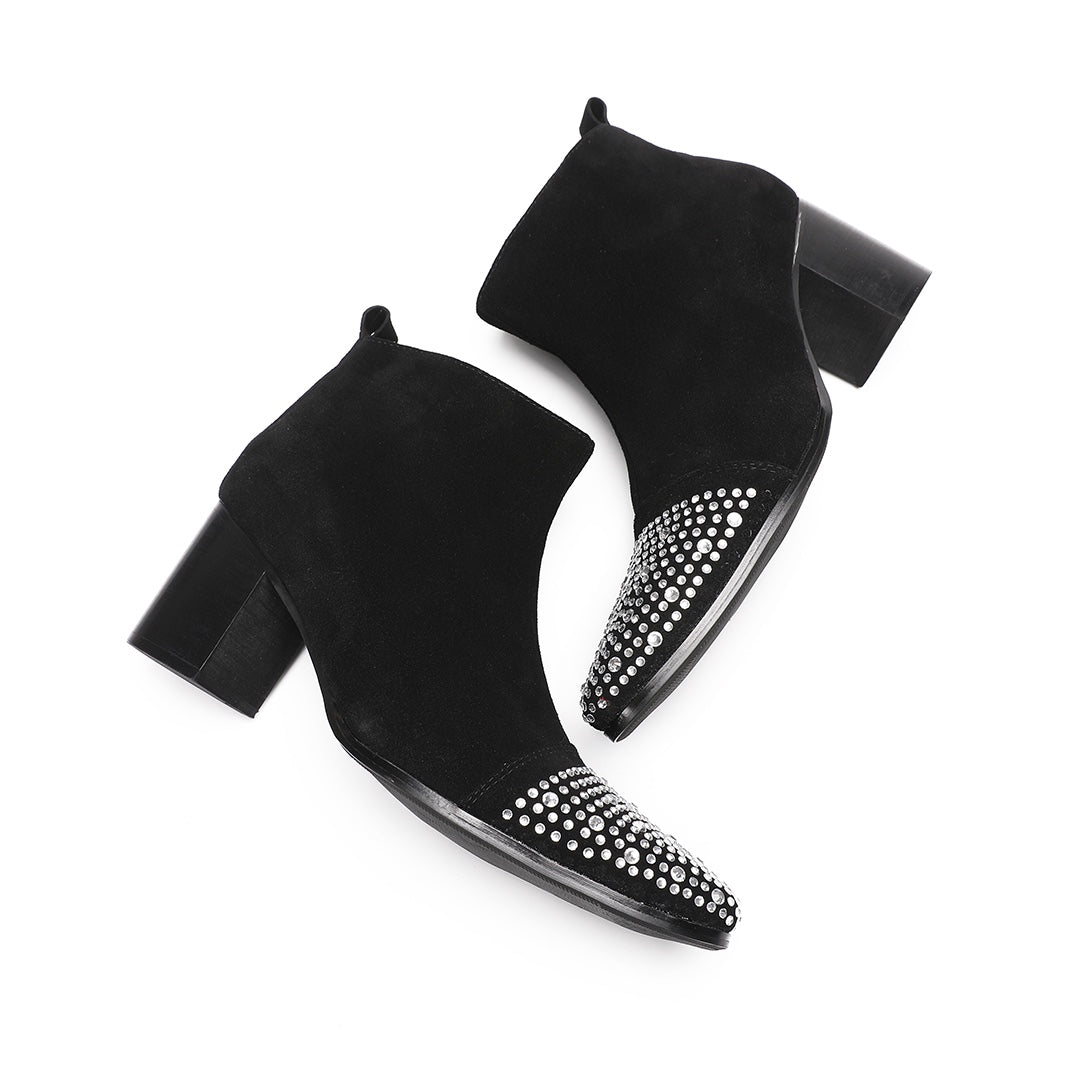 Pair of black suede ankle boots with a studded pointed toe and block heels, shown from various angles.