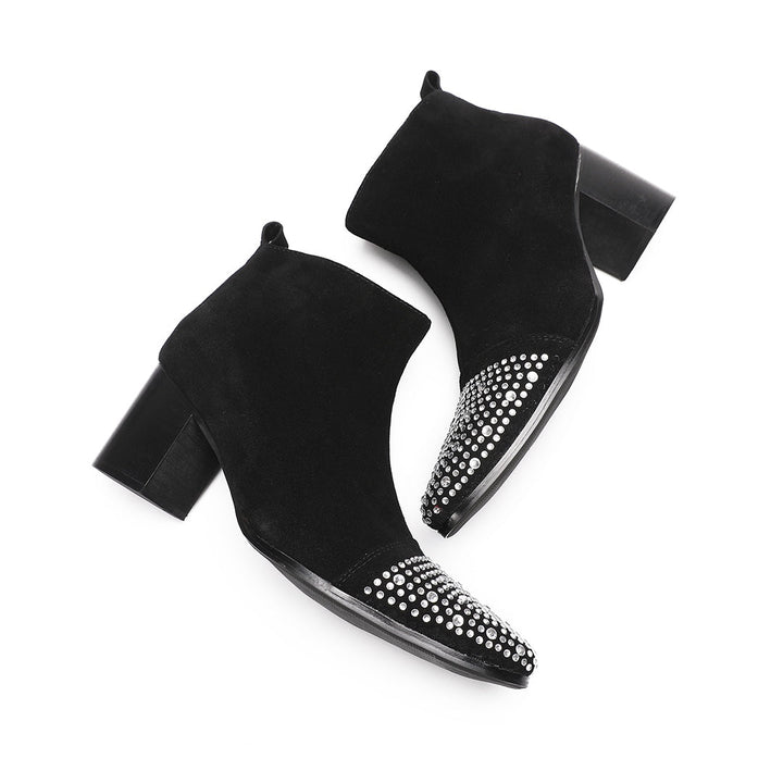 Pair of black suede ankle boots with a studded pointed toe and block heels, shown from various angles.