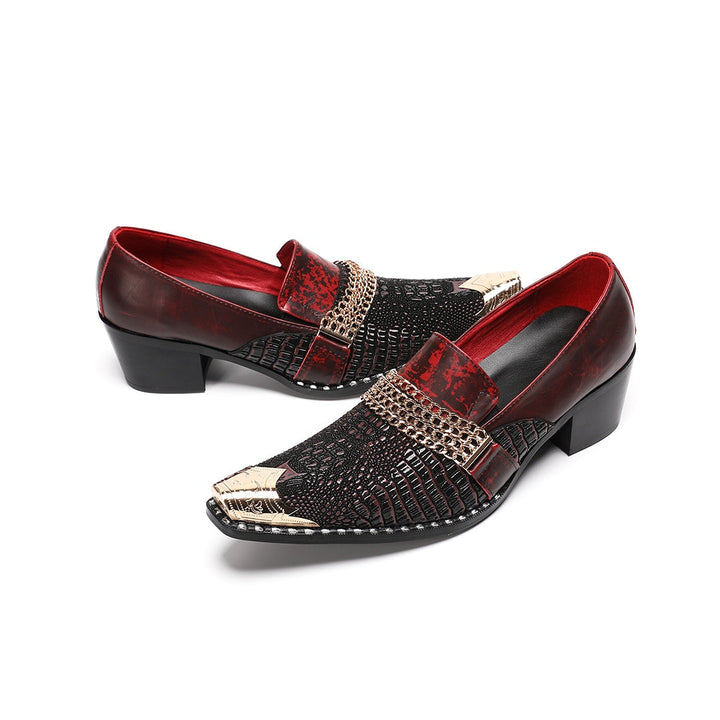 A pair of Dolashoes men's red and black textured leather loafers with gold metal toe caps and chain embellishments on a white