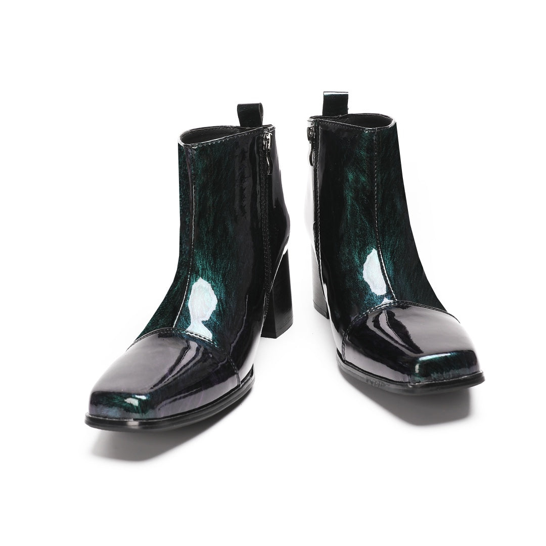 Pair of Dolashoes iridescent green-purple patent leather square toe ankle boots with block heels and side zippers, displayed