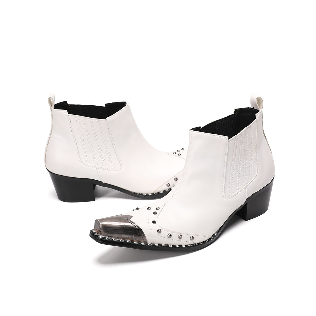 Pair of white studded Chelsea boots with silver metal toe caps and black heels on a white background.