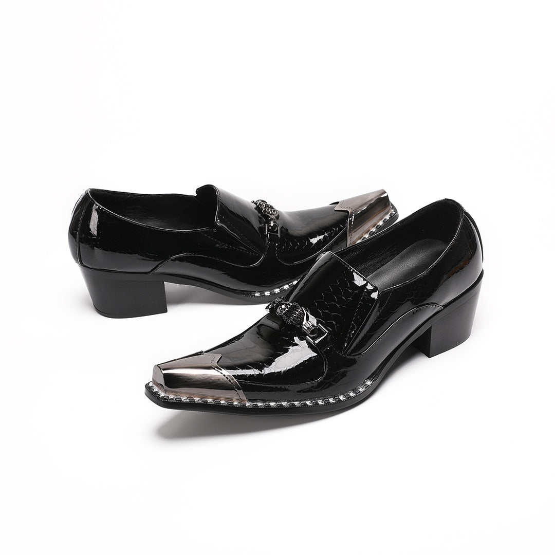 Pair of black patent leather men's loafers with silver metal cap toes and decorative buckles.