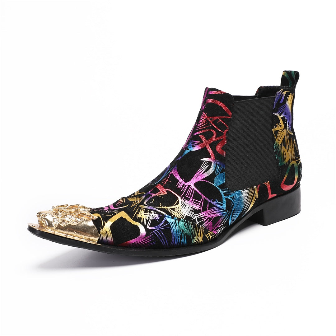 Pair of men's black Chelsea boots with a vibrant multi-color graffiti pattern and a gold metal pointed toe cap, shown from
