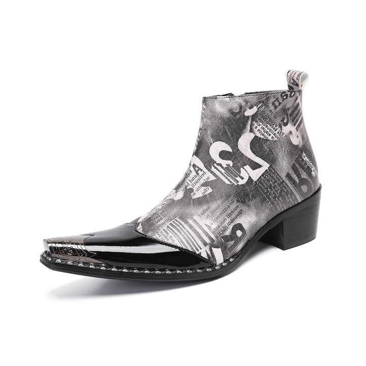Pair of men's black and white newspaper print ankle boots with a shiny black pointed toe and silver metal tip, side zipper