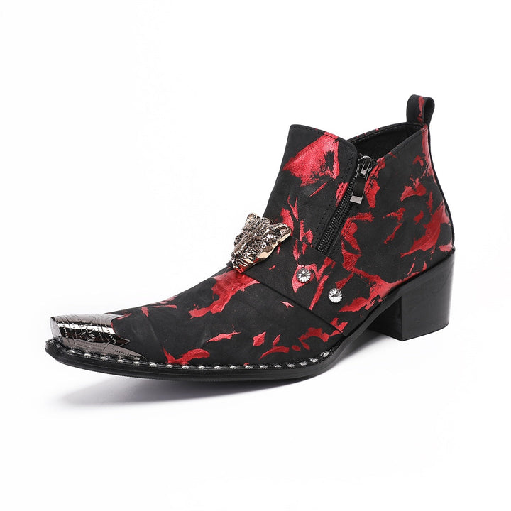 A pair of men's black and red patterned ankle boots with a silver metal pointed toe and a wolf head embellishment on the
