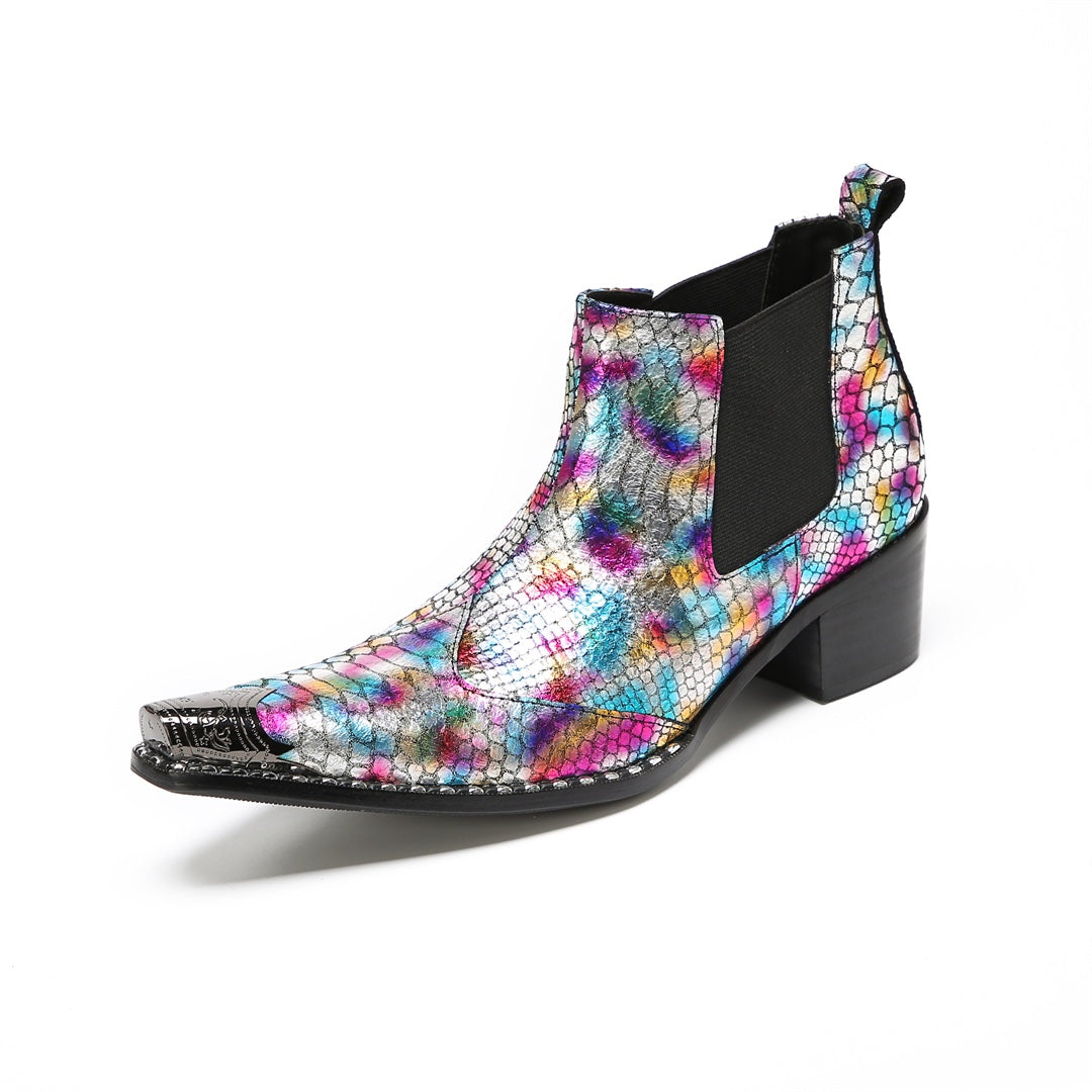 A pair of multi-color iridescent snakeskin Chelsea ankle boots with pointed metal toe caps and black block heels.
