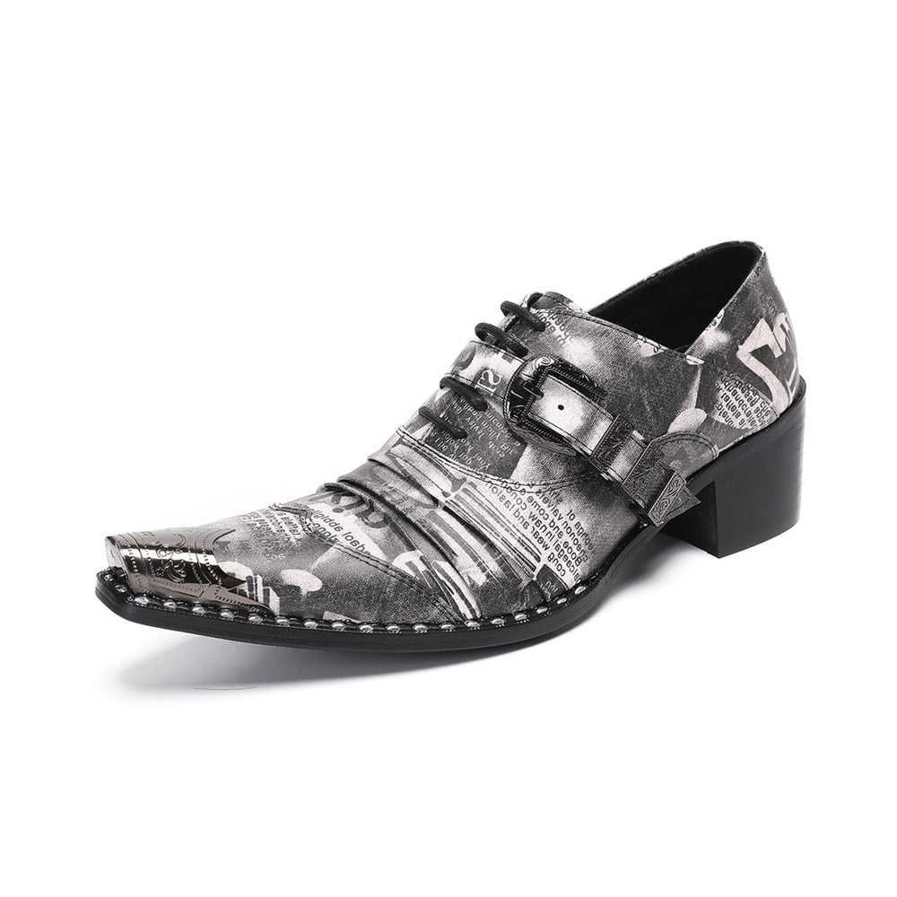 Pair of men's high heel derby shoes with a black and white newspaper print, pointed metal toe caps, and buckle details, shown