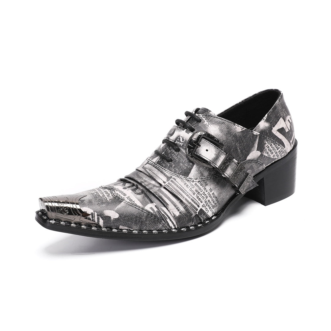 Pair of men's high heel derby shoes with a black and white newspaper print, pointed metal toe caps, and buckle details, shown