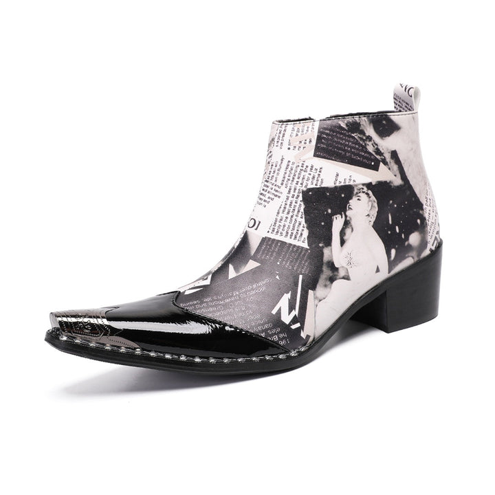 Pair of men's black and white newspaper print ankle boots with pointed patent leather toe and metal tip, side zipper, and
