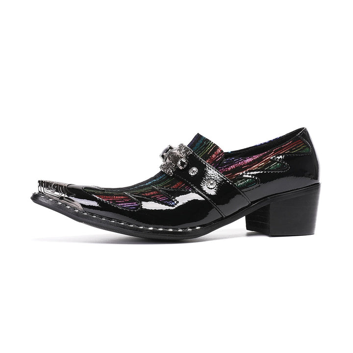 A single black patent leather men's dress shoe with a pointed metal toe, rainbow-striped vamp, and a decorative silver buckle