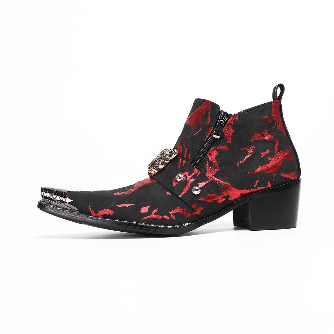 A pair of men's black and red patterned ankle boots with a silver metal pointed toe and a wolf head embellishment on the